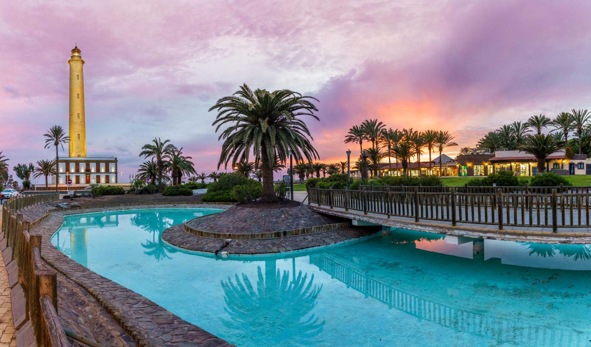 lighthouse maspalomas at sunset